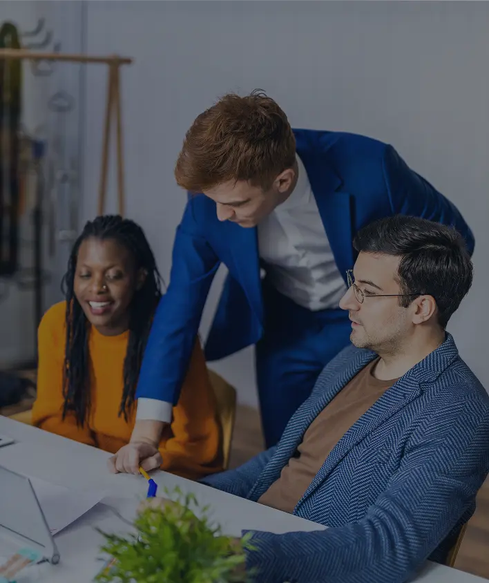 group of 3 people discussing